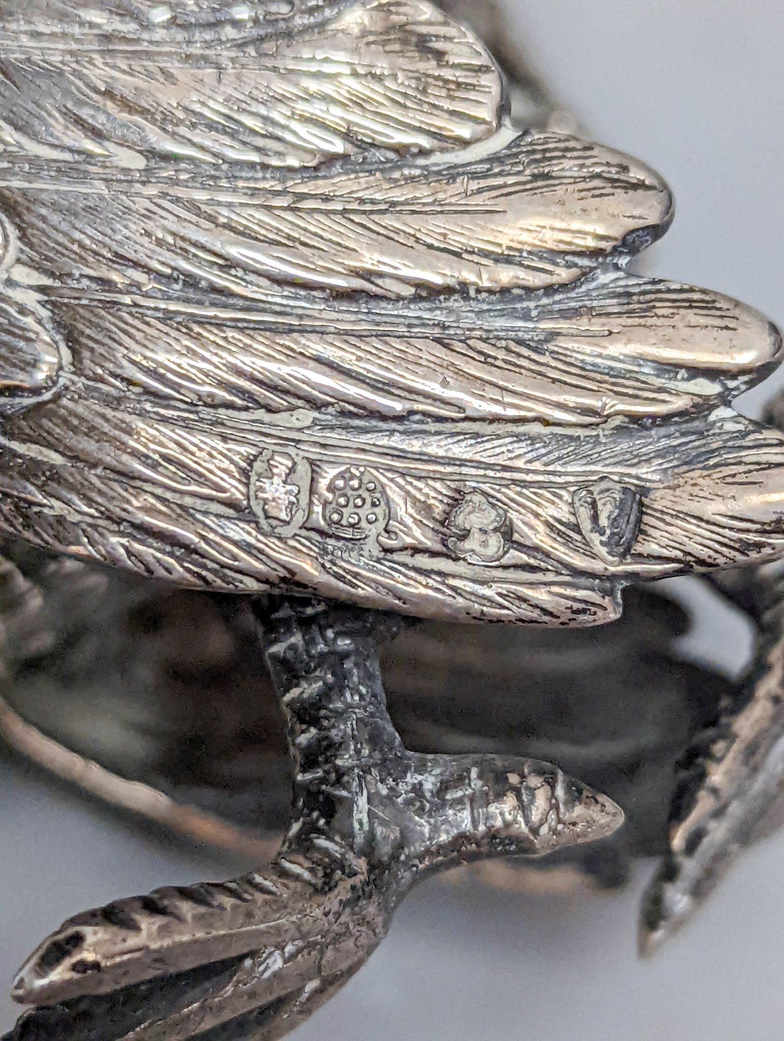 A late 19th /early 20th century Hanau silver free standing model of a game bird, 1930's import marks, height 10.4cm, 180 grams.